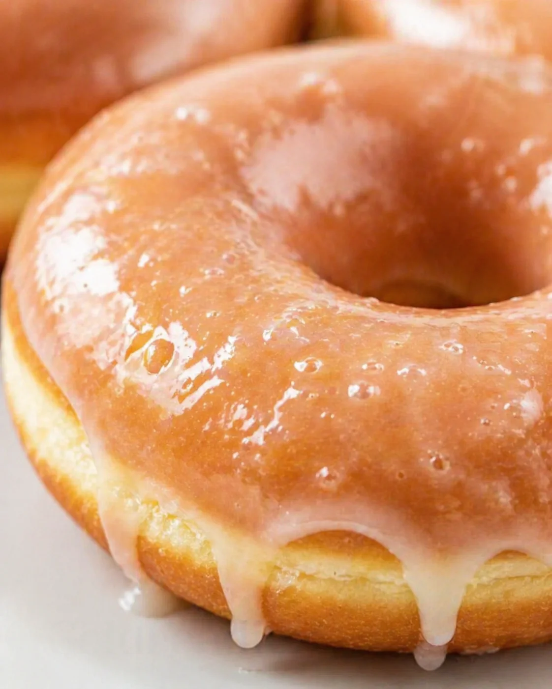 closing_final_dish-placeholder.png Tight detail shot of Krispy Kreme Copycat Donuts highlighting texture