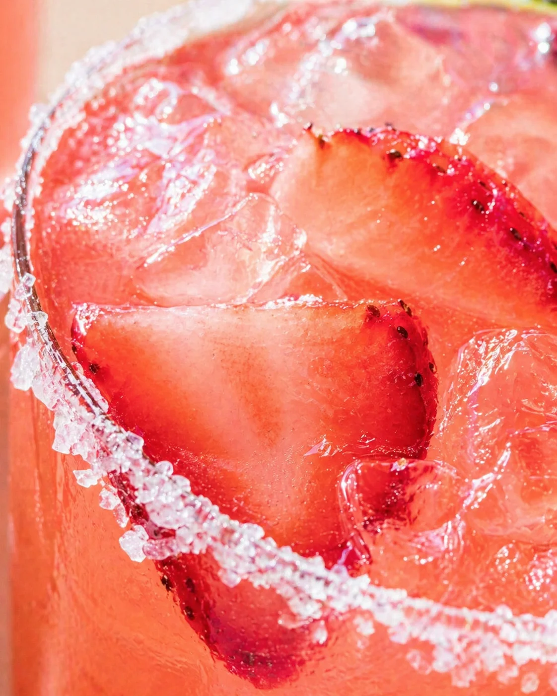 Tight detail shot of Strawberry Margarita on the Rocks - SO GOOD! highlighting texture