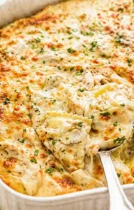 Final plated Cheesy Alfredo Ravioli Casserole served as a hero shot