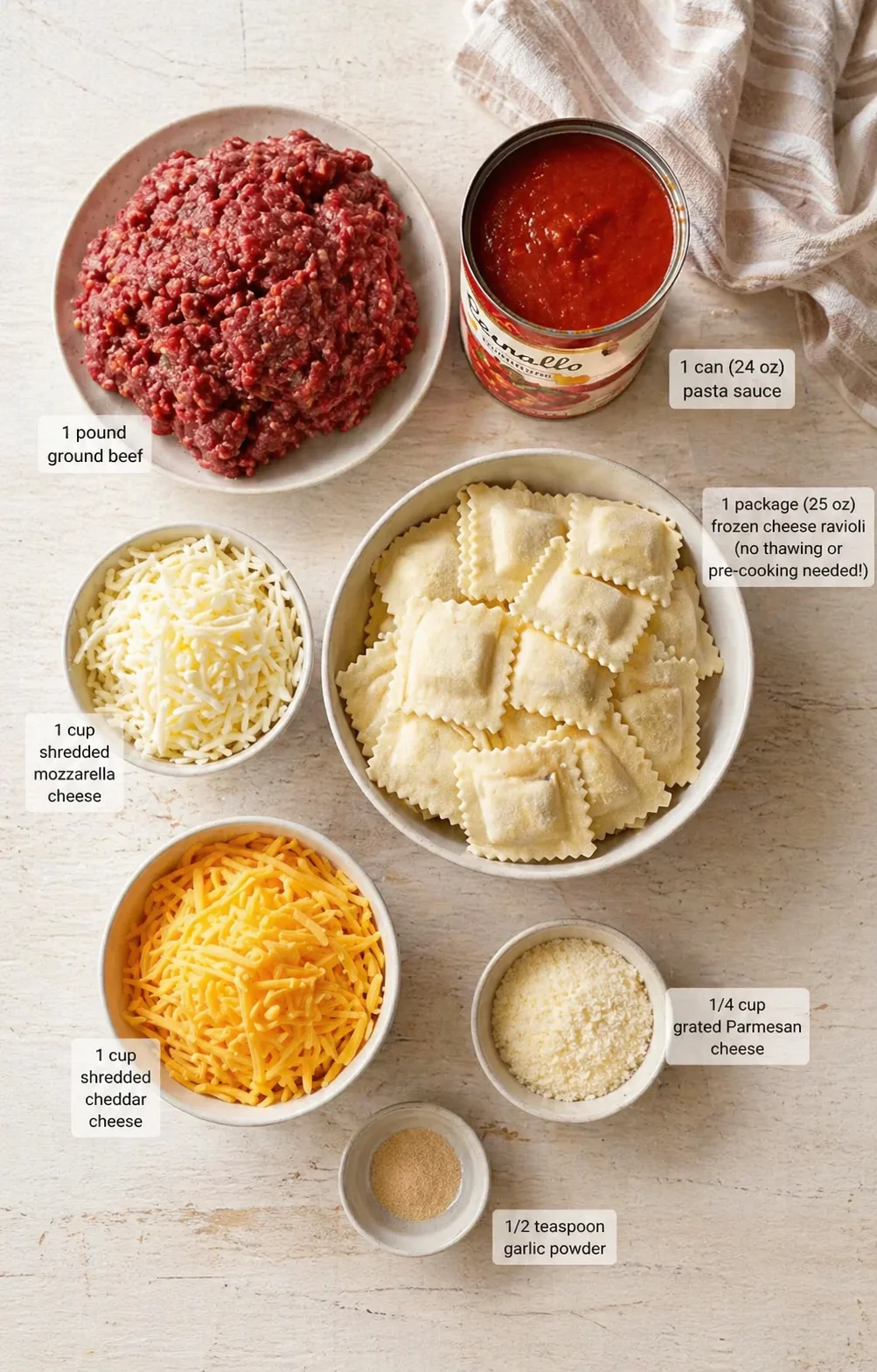 ingredients-placeholder.png Measured ingredients arranged for Crockpot Ravioli Lasagna recipe: 1 pound ground beef, 1 can (24 oz) pasta sauce, 1 package (25 oz) frozen cheese ravioli (no thawing or pre-cooking needed!), 1 cup shredded mozzarella ch