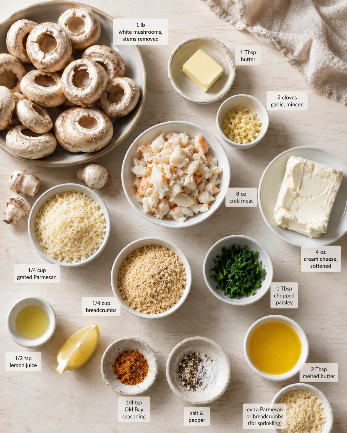 top-down layout of mushrooms and ingredients for crab-stuffed mushrooms on a light wooden surface