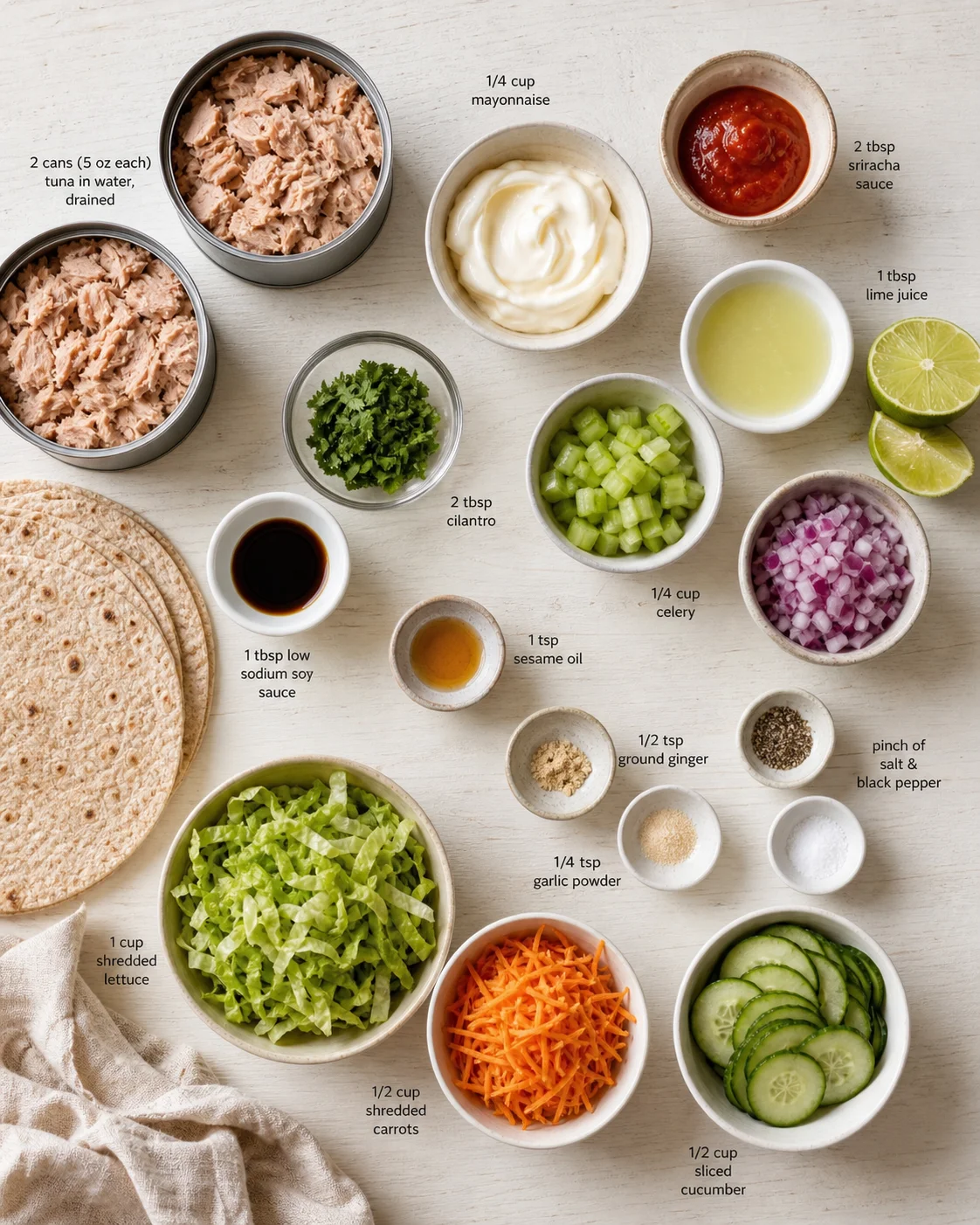 flat lay of labeled tuna salad ingredients arranged on a light surface