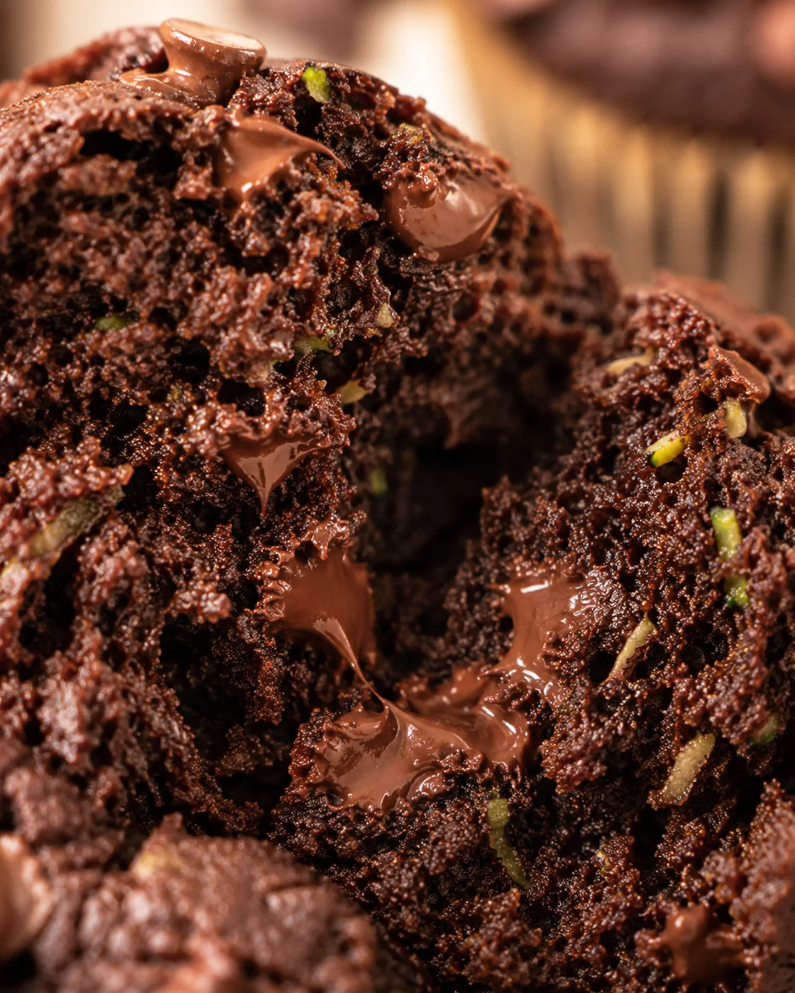 Delicious Vegan Chocolate Zucchini Muffins Close-up of moist, tender vegan chocolate zucchini muffins with gooey chocolate chips
