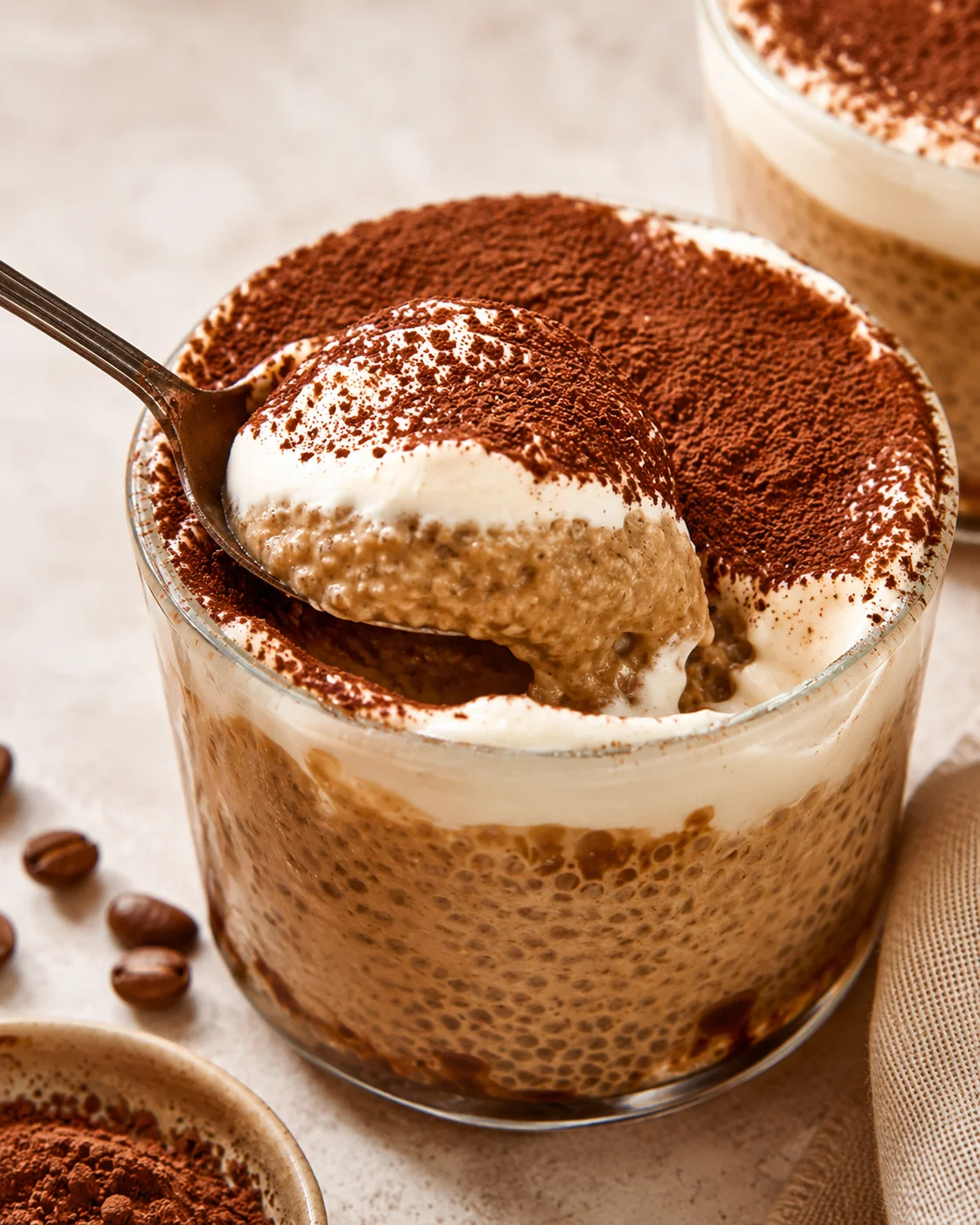Delicious Tiramisu Chia Pudding Creamy tiramisu chia pudding topped with cocoa powder and whipped cream